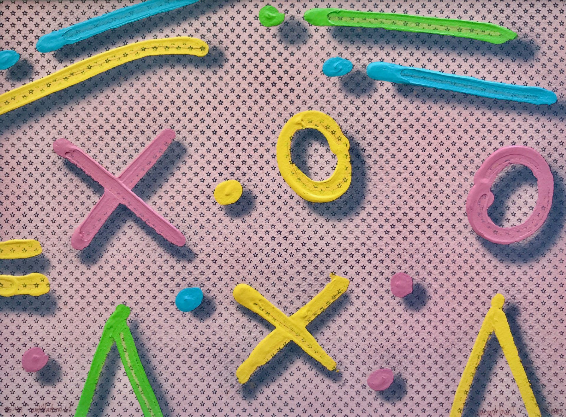 A bunch of colorful letters and numbers on a pink background