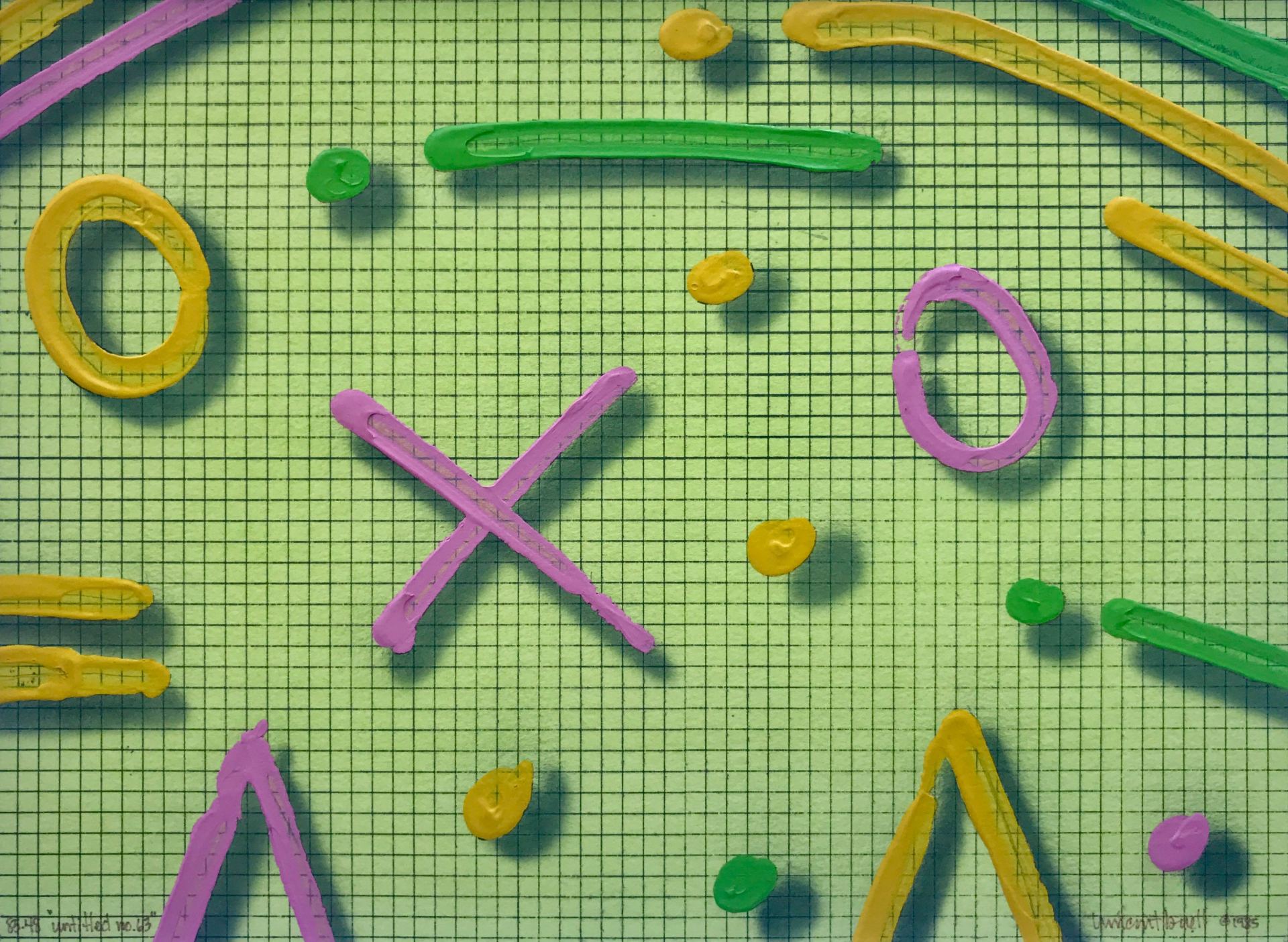 A bunch of colorful letters and numbers on a green checkered background