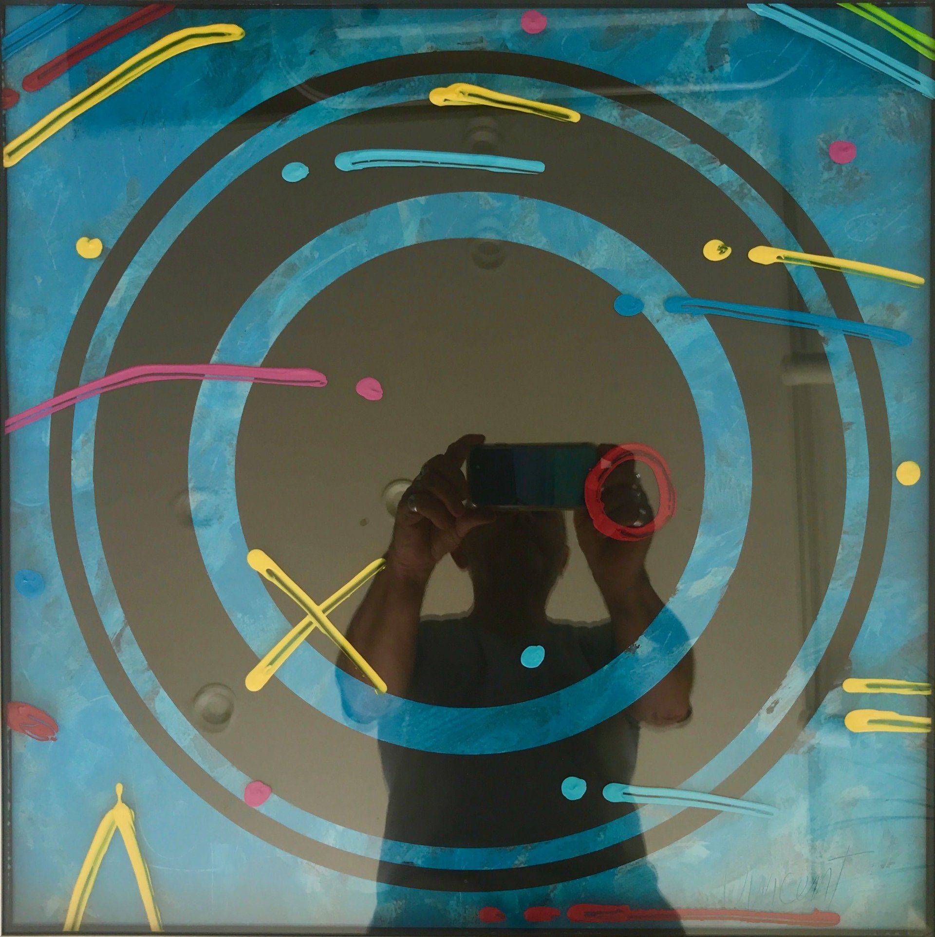 A man is taking a picture of himself in a mirror