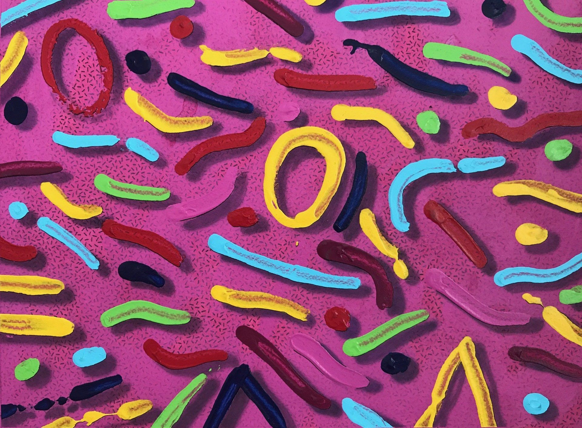 A pink background with a bunch of colorful shapes on it