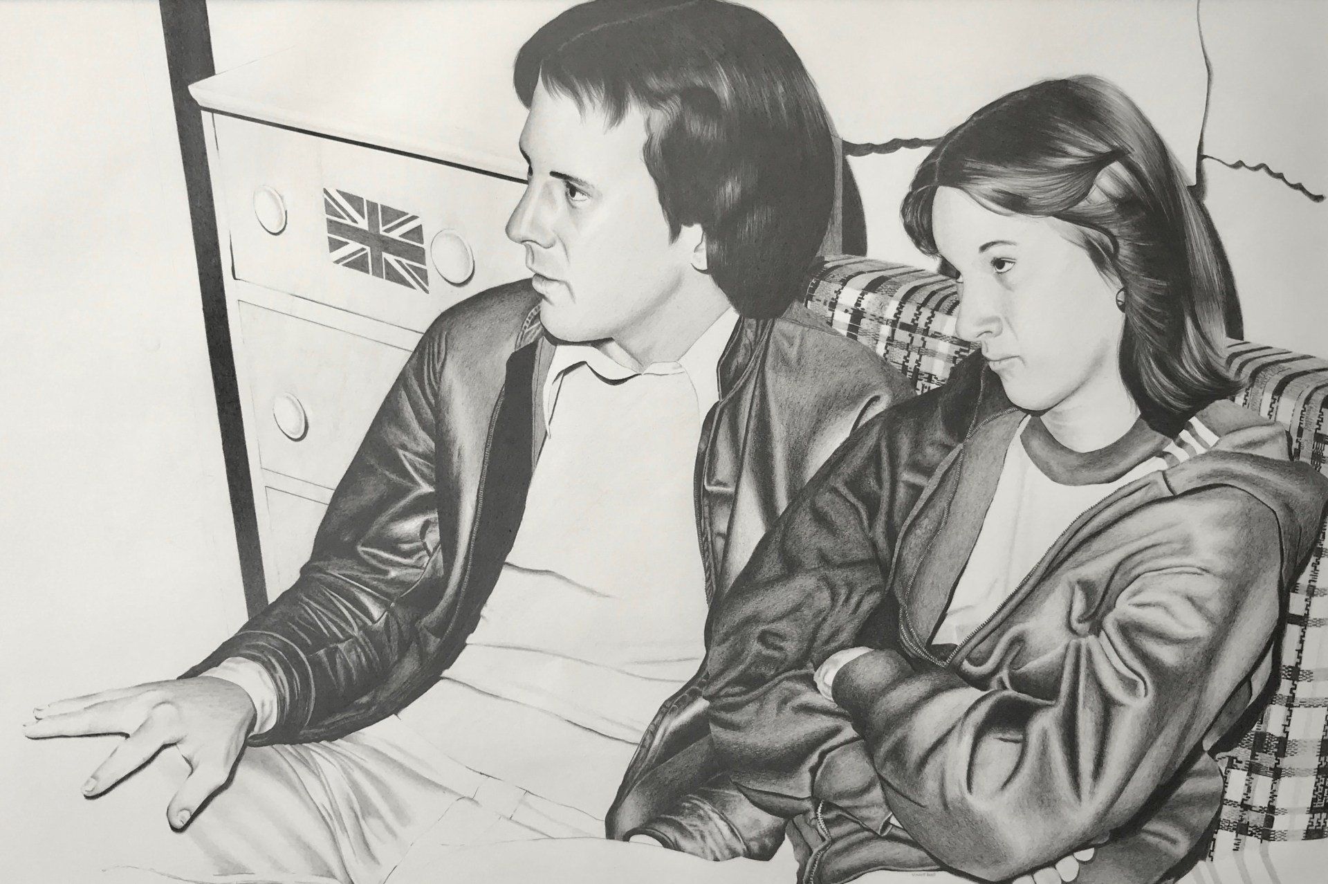 A black and white drawing of a man and a woman sitting on a couch