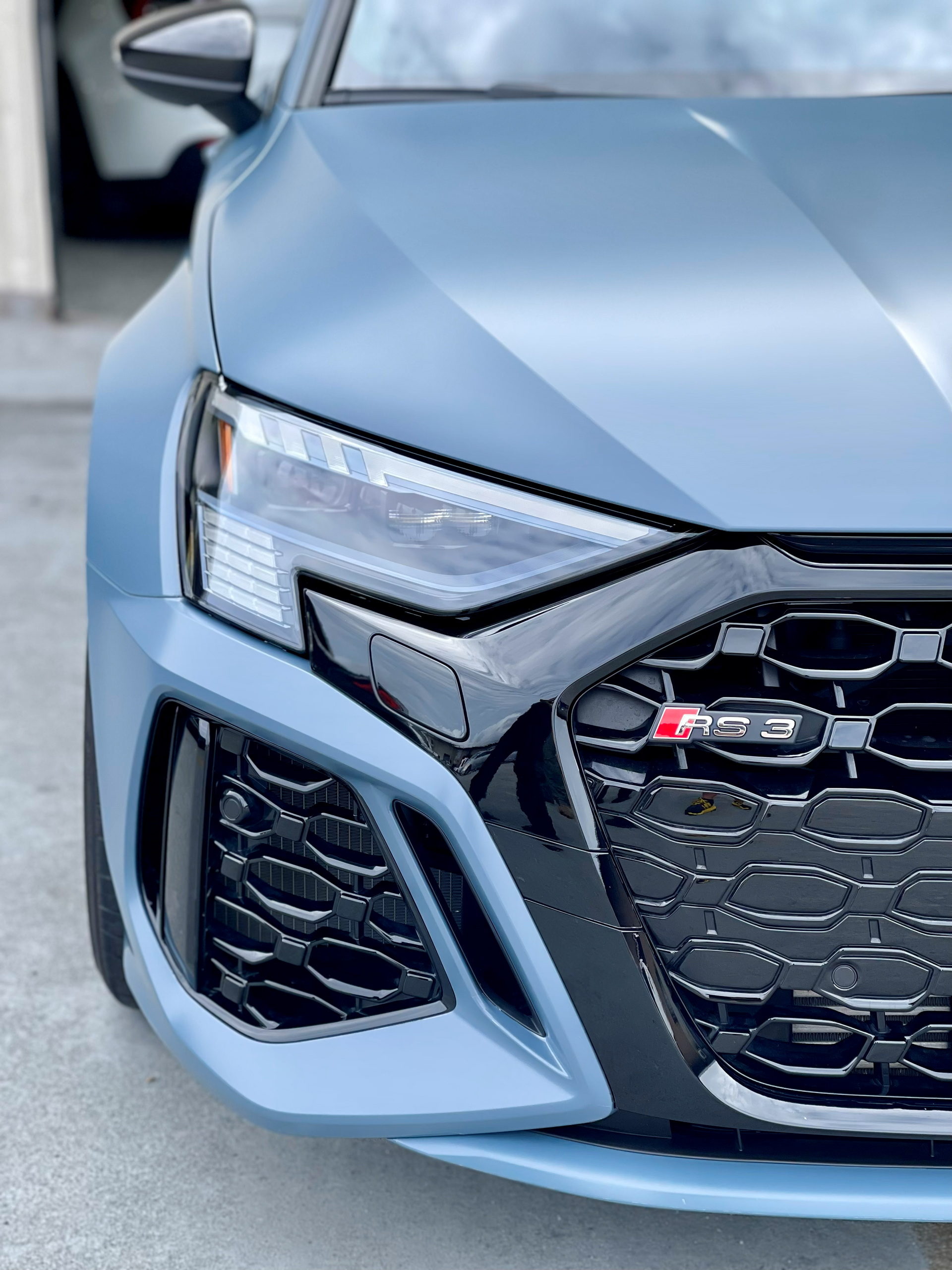 A truck is parked in front of a sign that says fusion