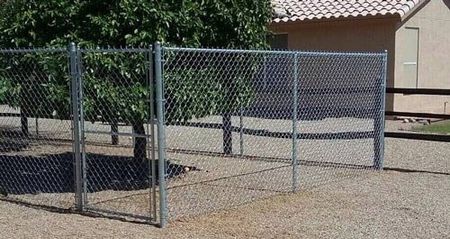 chain link fence near trees - chain link fence contractor