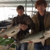 boys holding bass