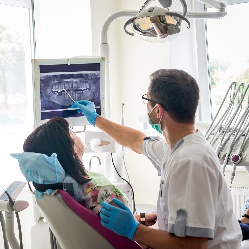 Dentist Explaining X-Ray Result — Sarasota, FL — Sterling Dental