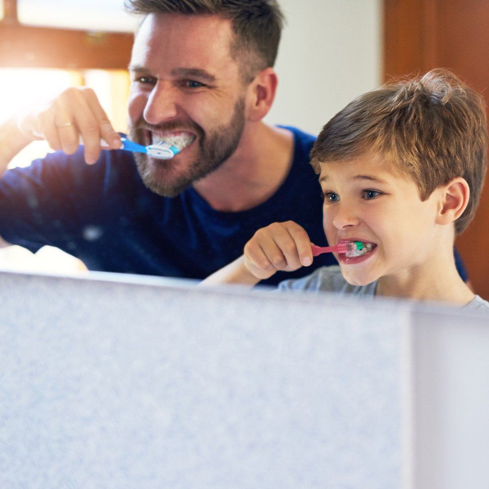 Father and Son Brushing Teeth — Sarasota, FL — Sterling Dental