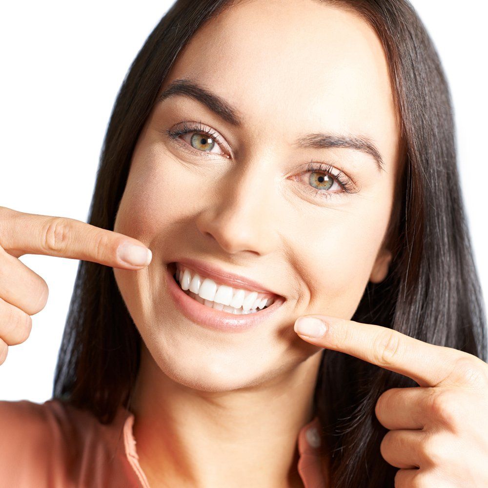Lady Pointing To Her Teeth — Sarasota, FL — Sterling Dental