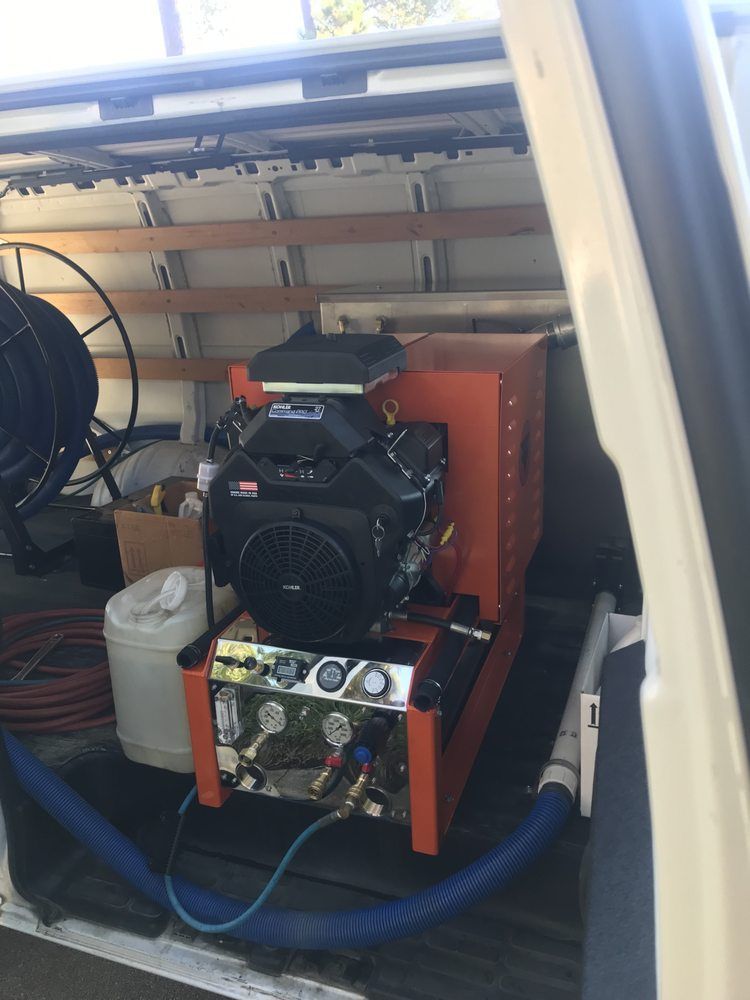 A machine is sitting in the back of a van.