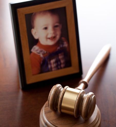Photo of young child and legal gavel in Erie, PA