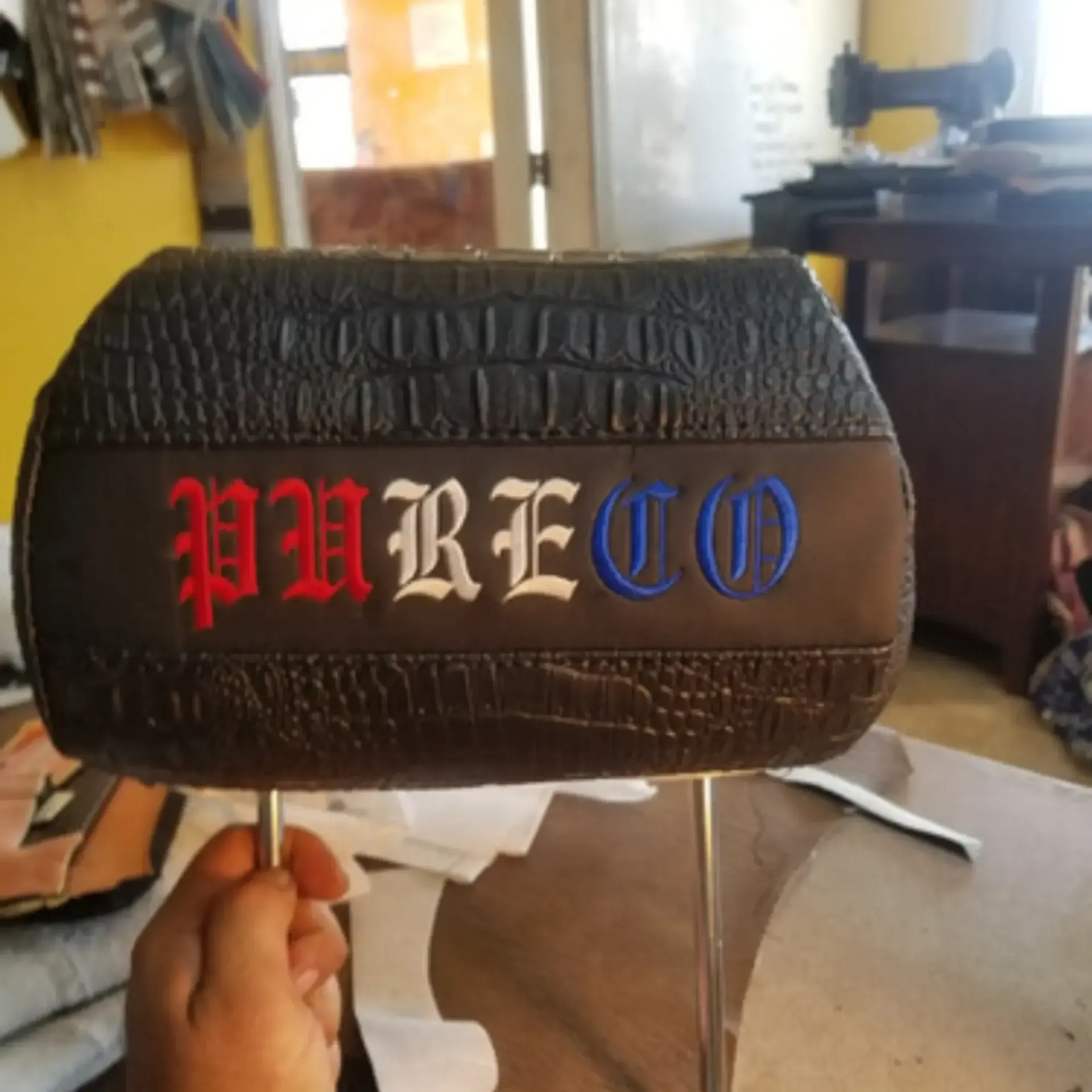 Piece By Piece of Houston LLC
 - A person is holding a headrest cover that says pureo