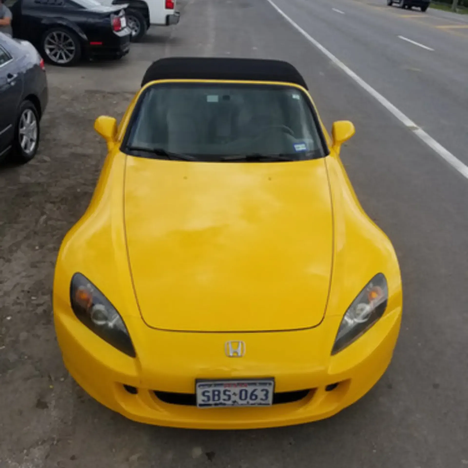Piece By Piece of Houston LLC
 - A yellow car with a license plate that says srs-063