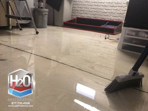 photo of water that has leaked onto a basement floor