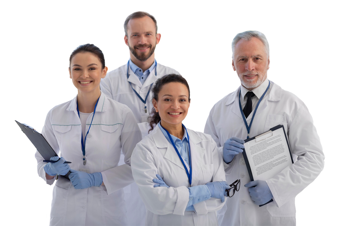 Group of four scientists in lab coats, smiling.