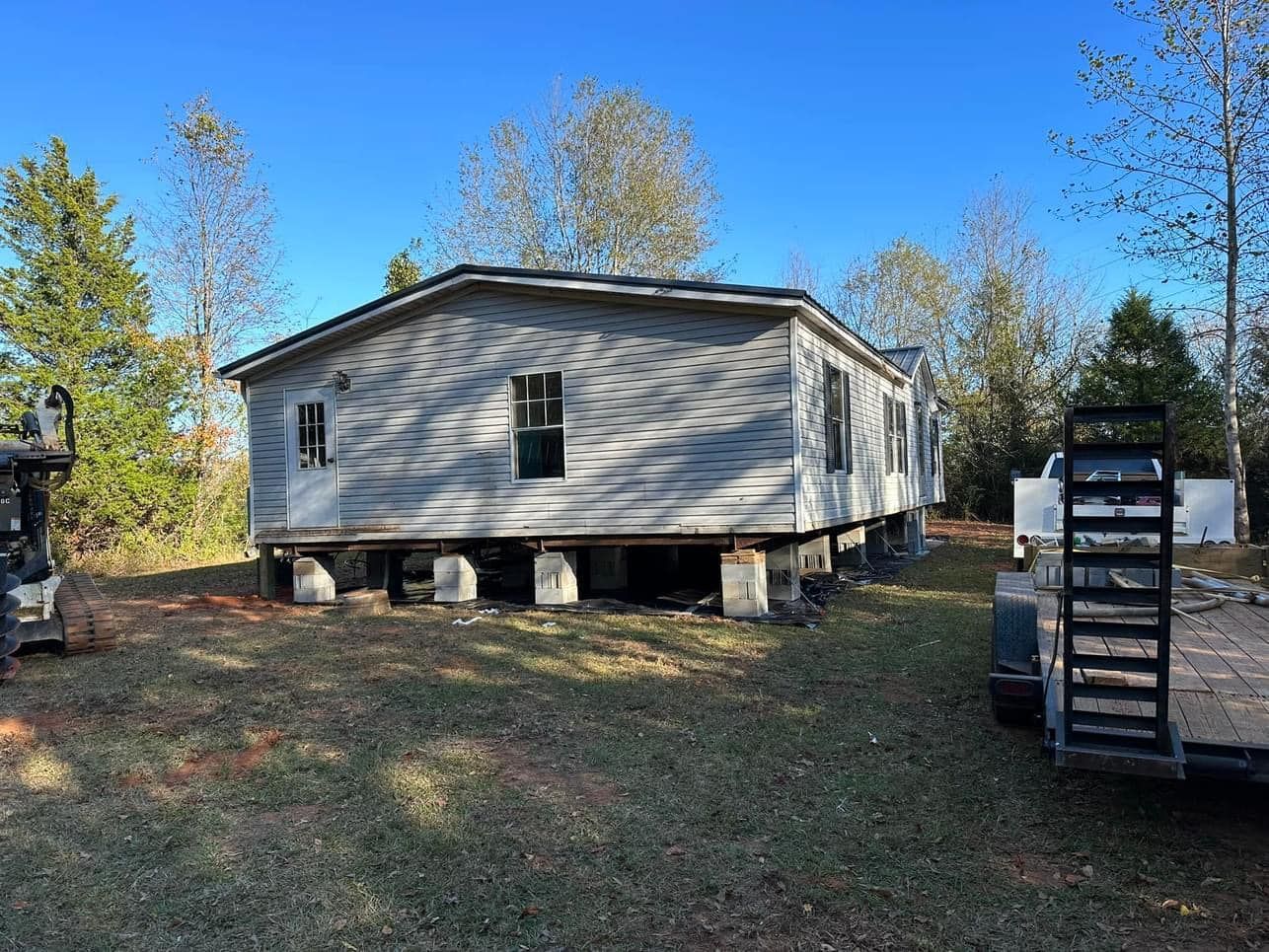 A mobile home is being moved into a new location.