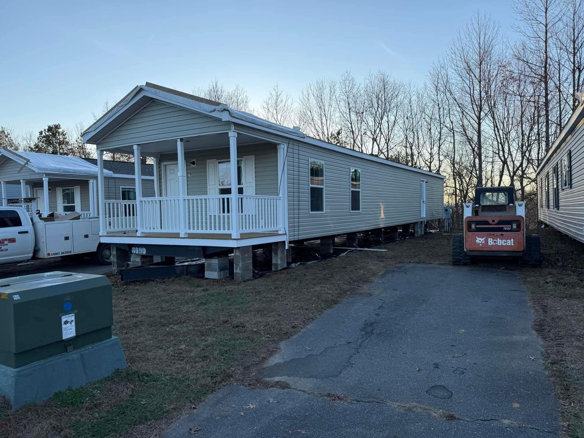 A mobile home is being moved to a new location.