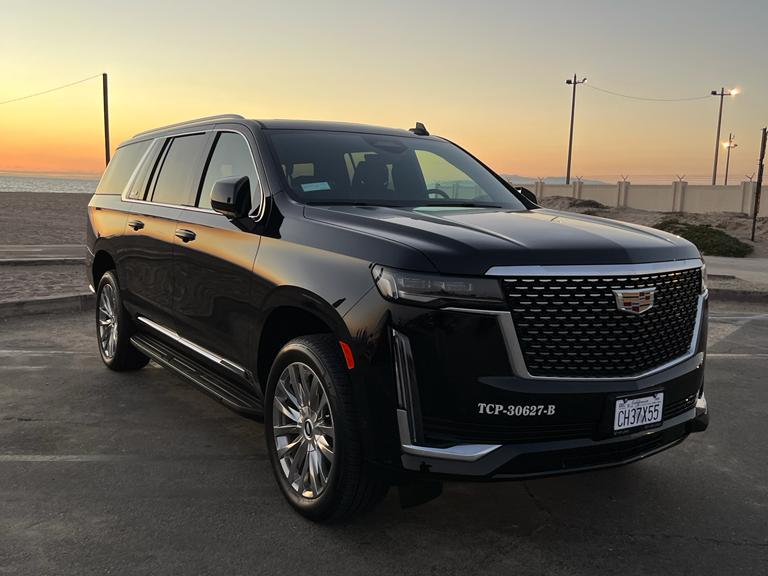 LAX VIP luxury suv at sunset