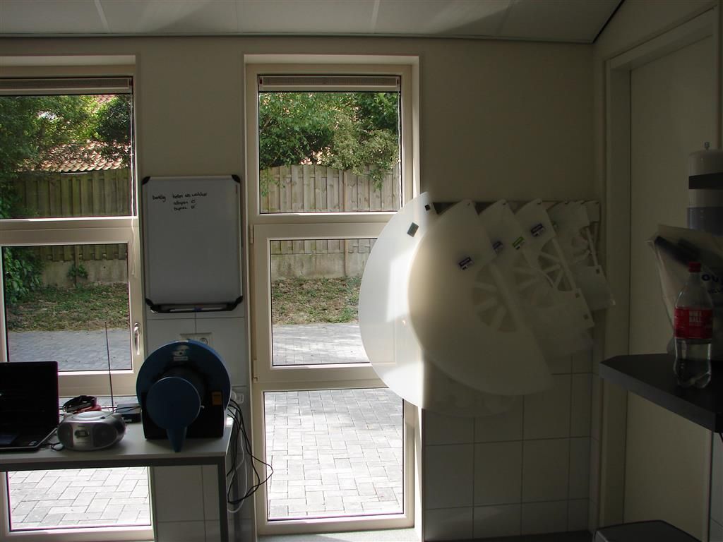 A room with a white board that says ' a ' on it