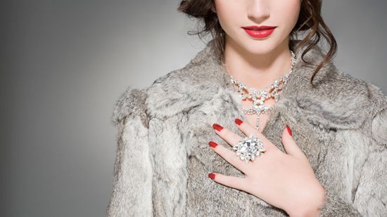 Woman Wearing Fur Coat and Jewelry — Bayonne, NJ — Famous Furs Ltd.