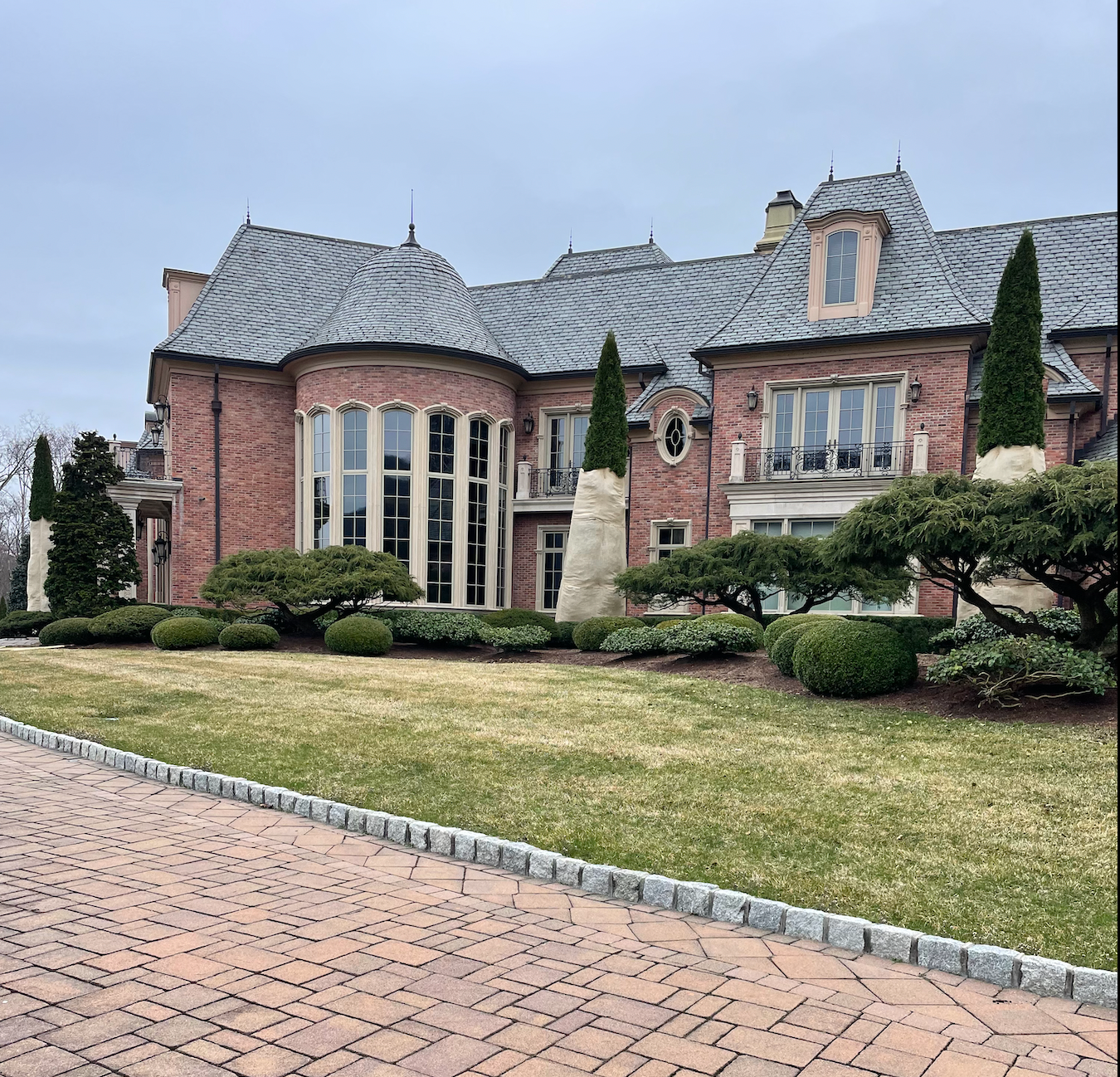 A large brick house with a metal roof
