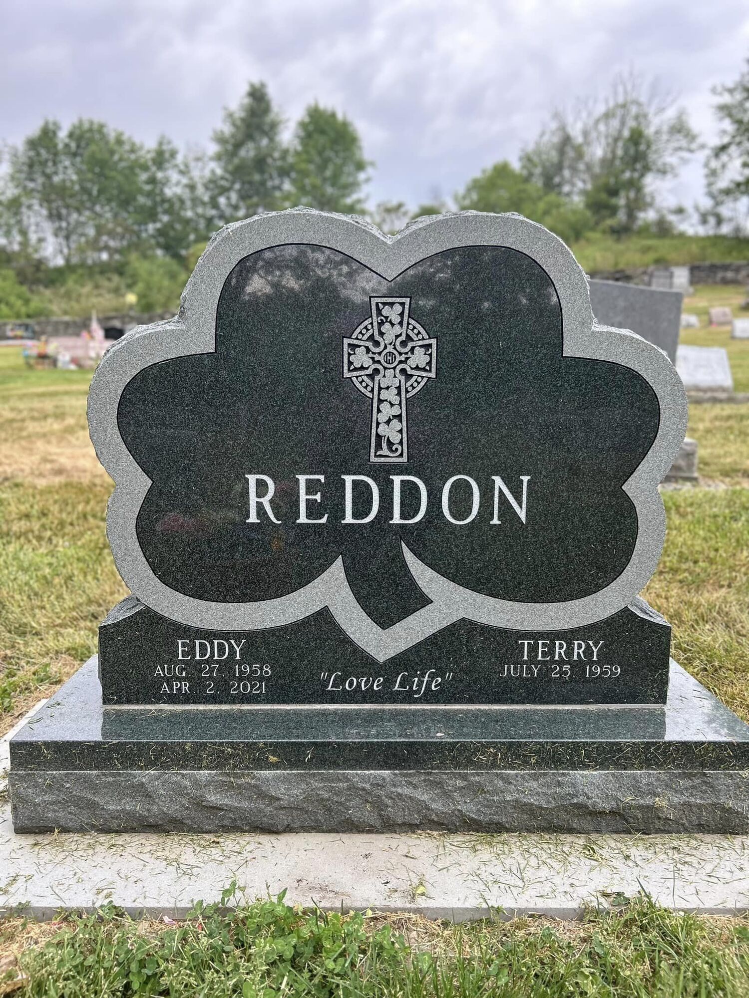 Dark green headstone with 