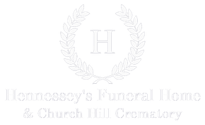 Logo of Hennessy's Funeral Home & Church Hill Crematory: wreath around an 