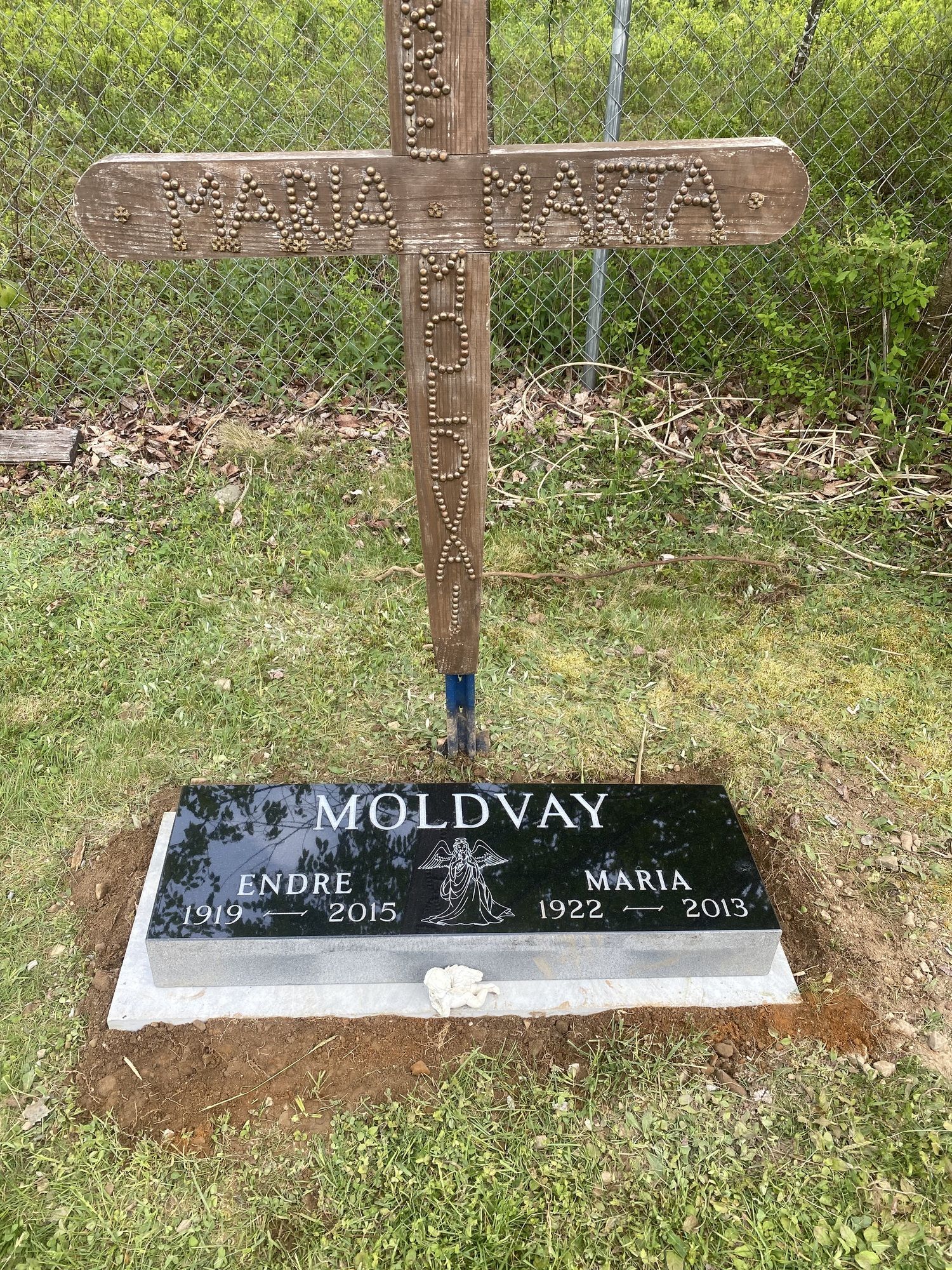 Gravestone with the name MOLDOVAY; wooden cross above with two names.