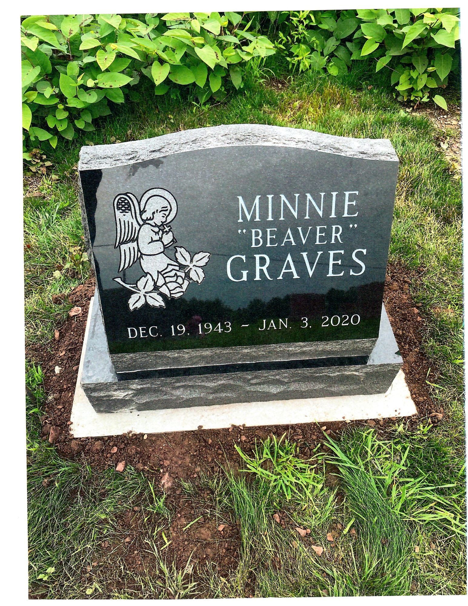 Black headstone with 
