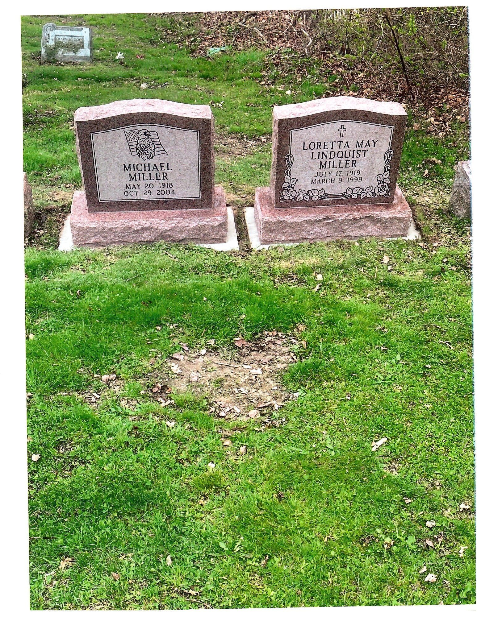 Two headstones in a grassy cemetery, with the names and dates of the deceased.