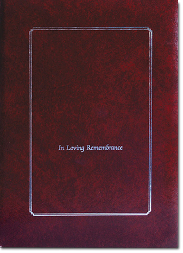 Maroon memorial book with silver-outlined rectangle on the front, reads 