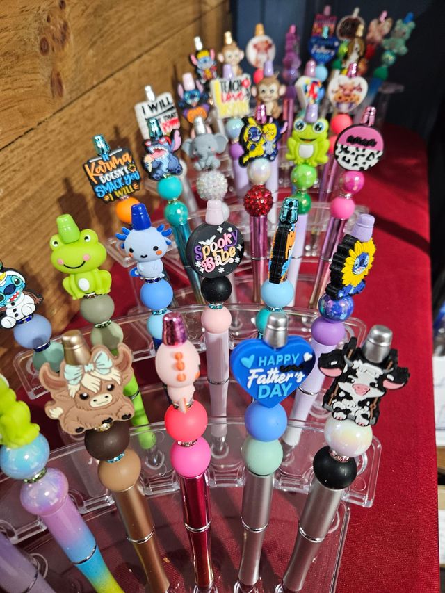 A display of pens with one that says happy father 's day