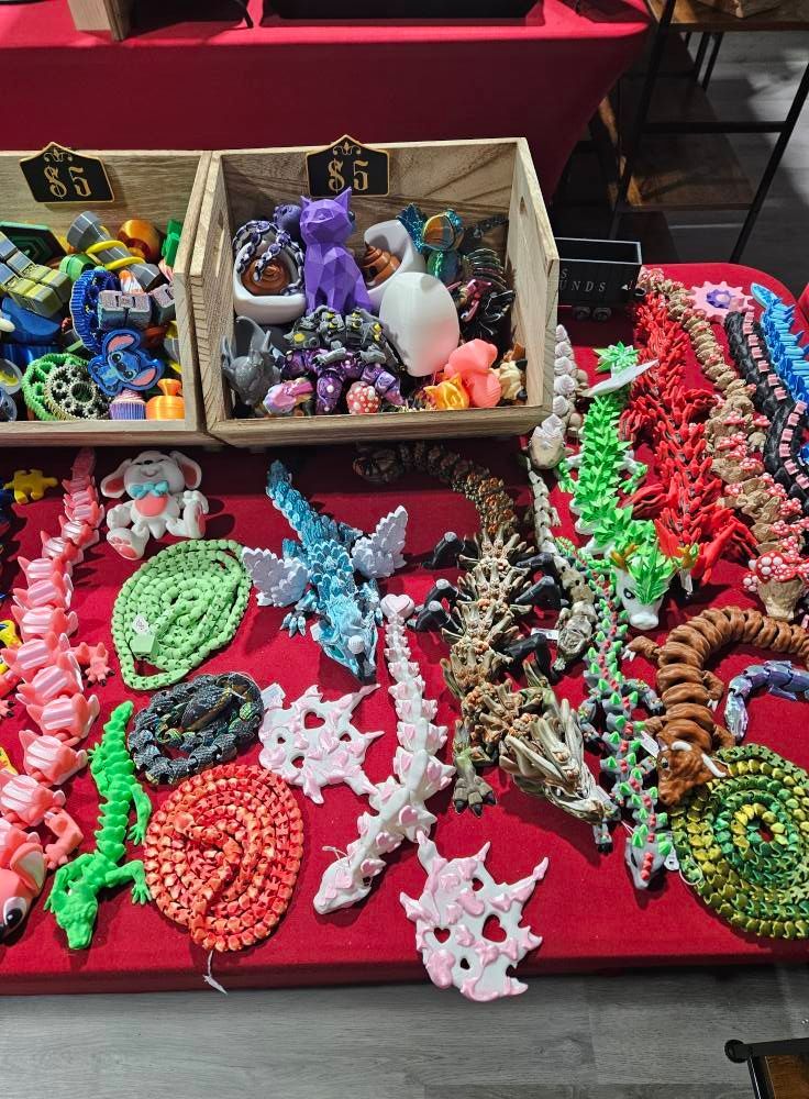 A table topped with a variety of 3d printed toys.