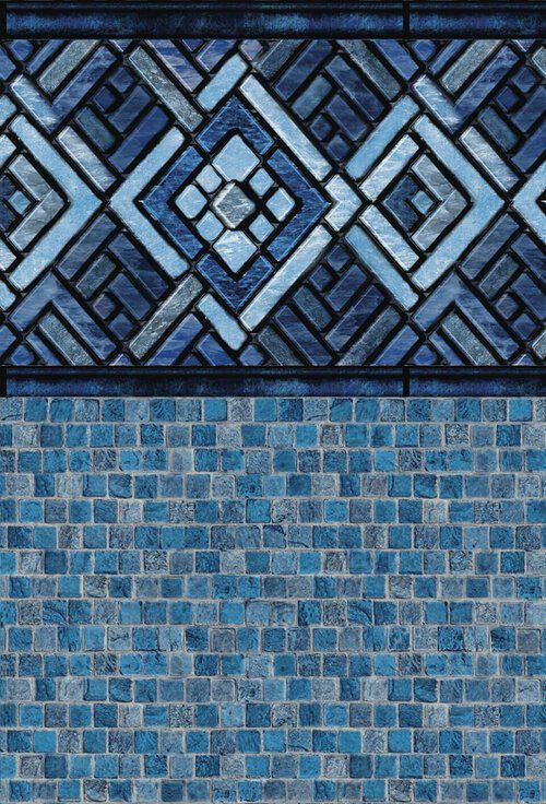 Un gros plan d un mur de carreaux bleus avec un motif géométrique.