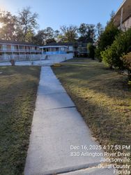 Sidewalk leading to a motel. Jacksonville, Florida. Date/time stamp present.
