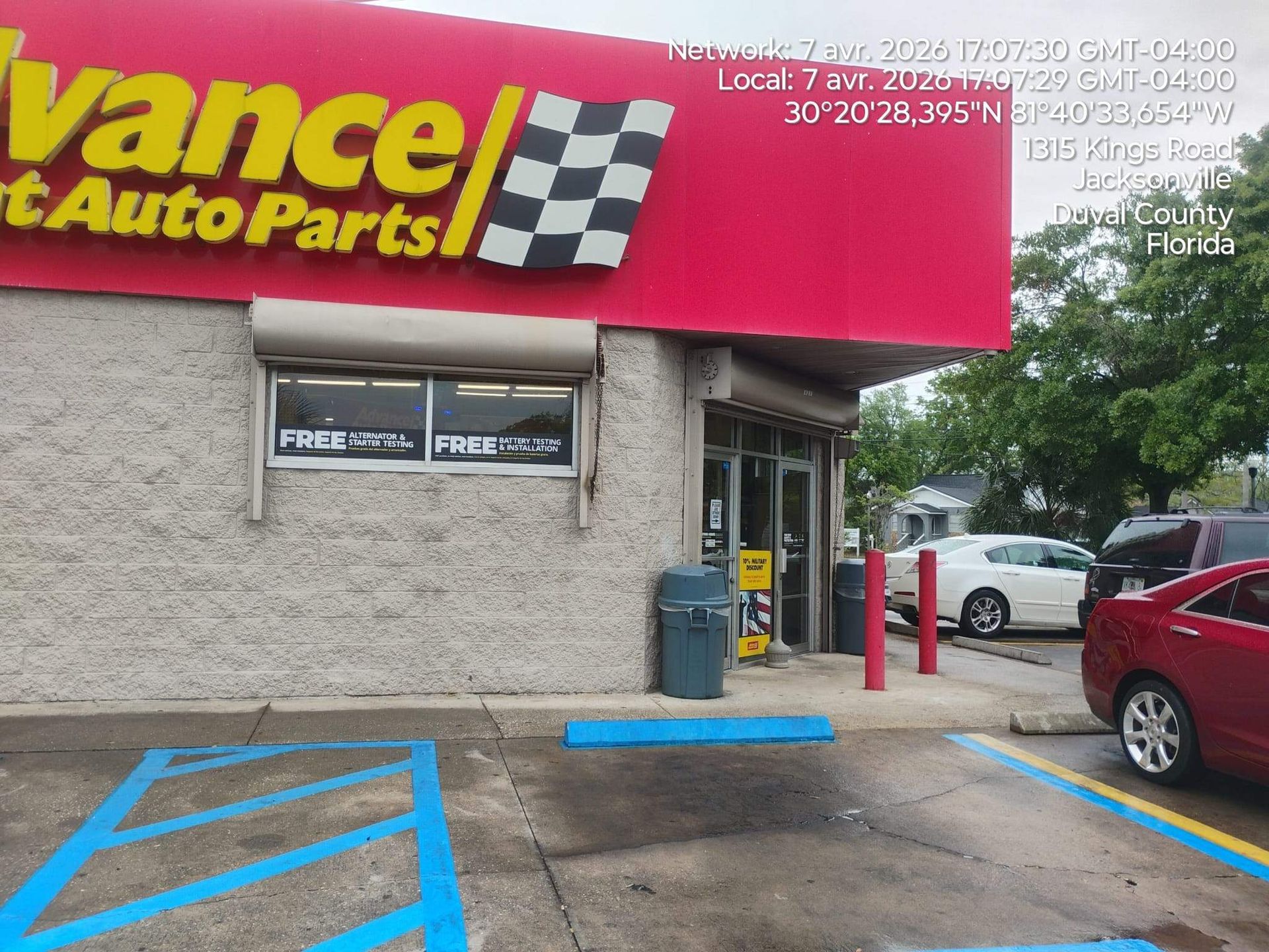 Advance Auto Parts storefront with red sign, blue accessible parking spaces, and a parked car outside