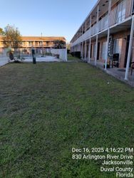 Lawn in front of apartment buildings. Date and address on the bottom. Jacksonville, Florida.