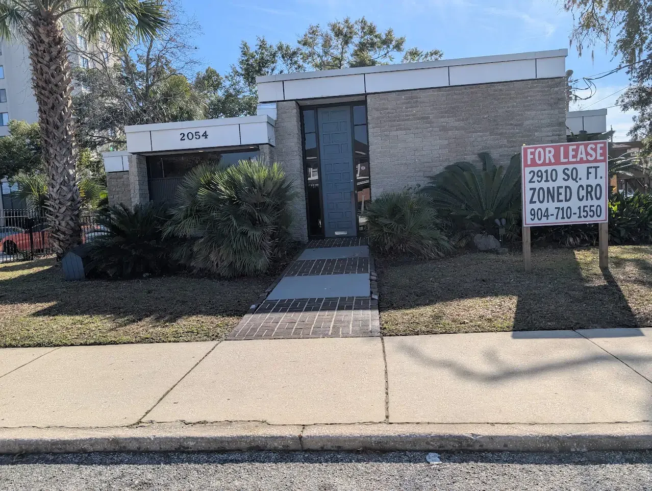 Small, single-story brick building with a 