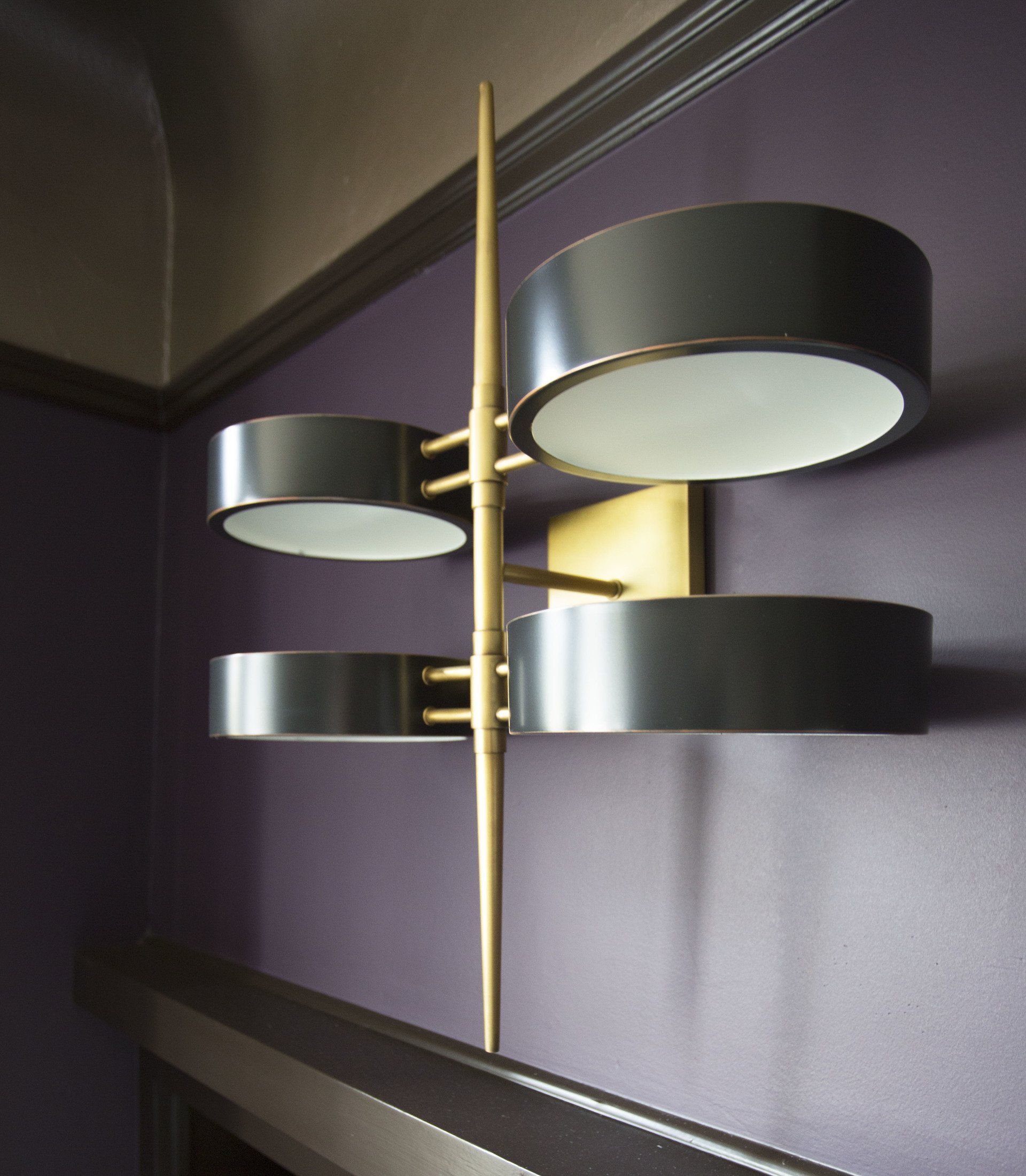 A purple wall with a light on it