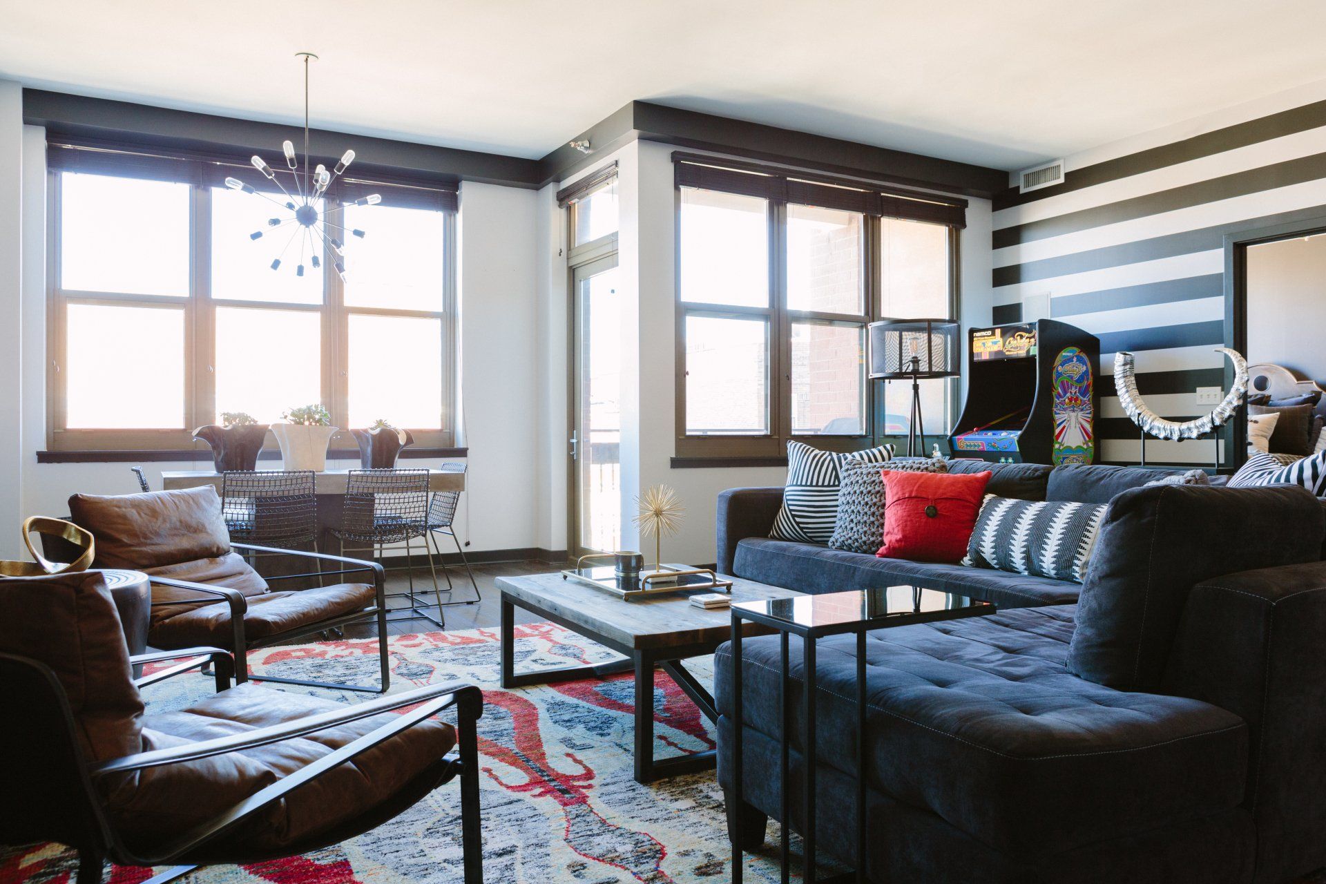 A living room filled with furniture and a large window.