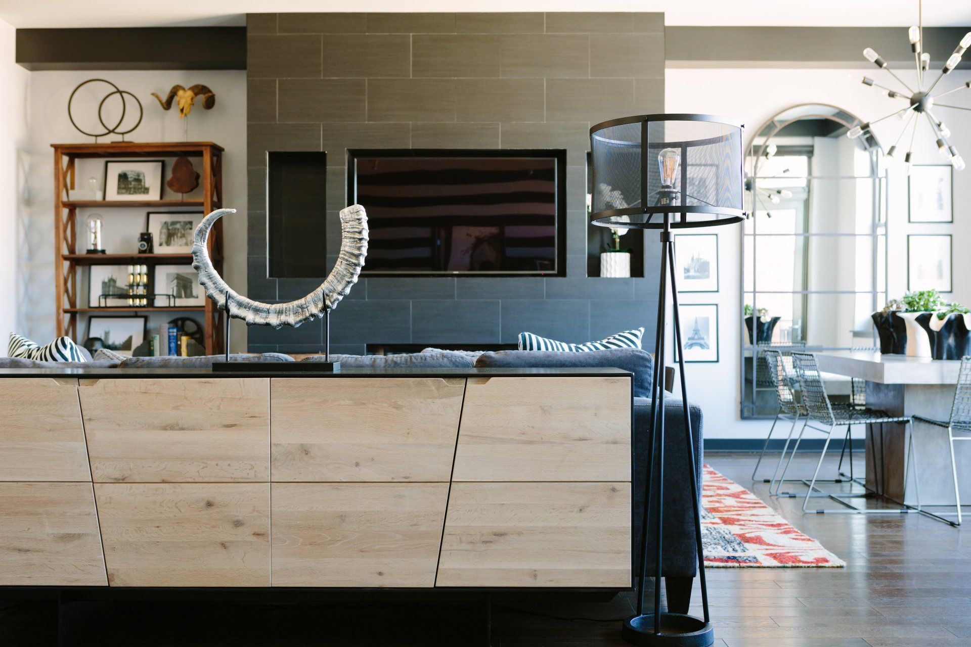 A living room with a fireplace and a flat screen tv