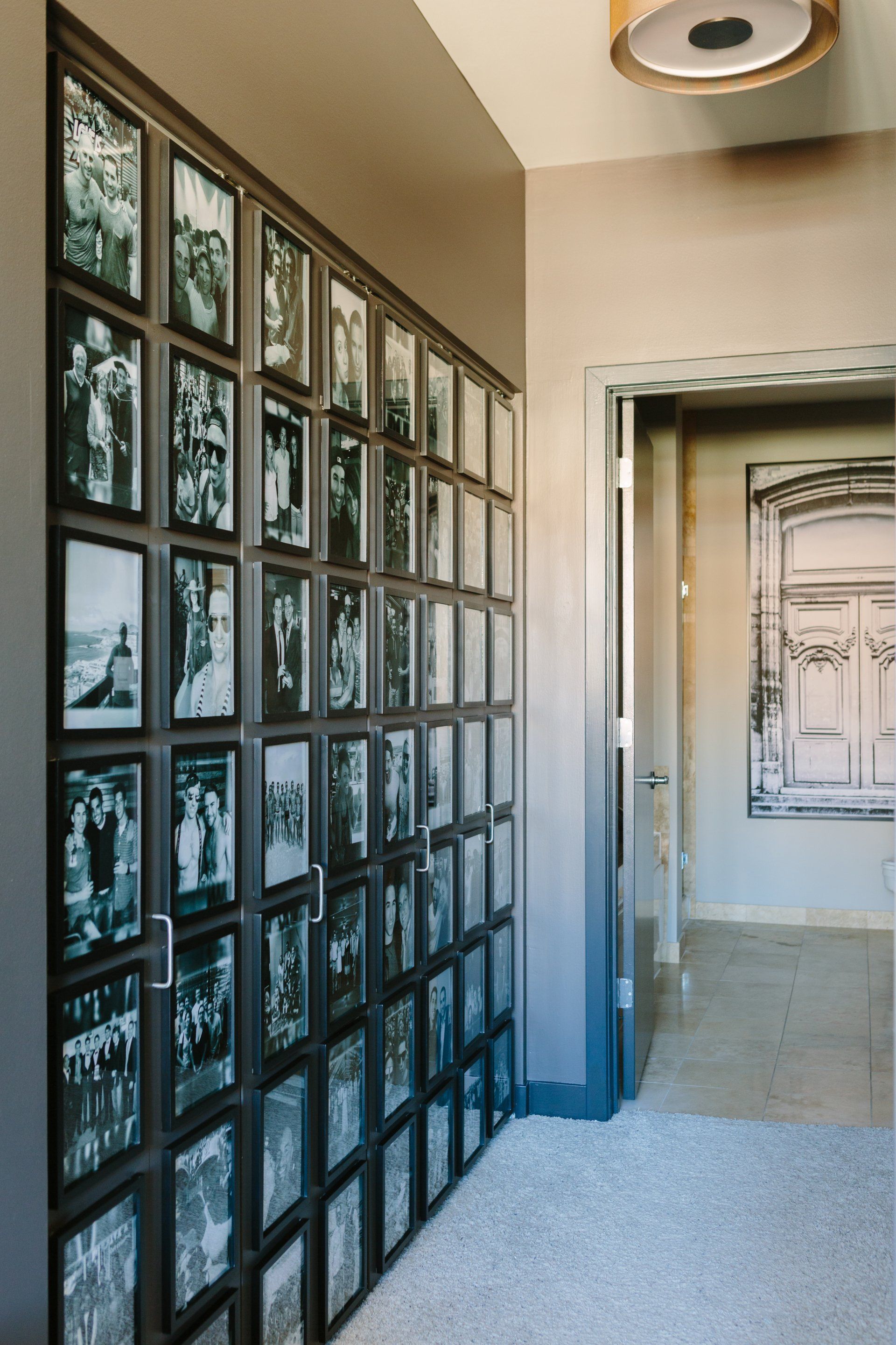 A hallway with a lot of pictures on the wall