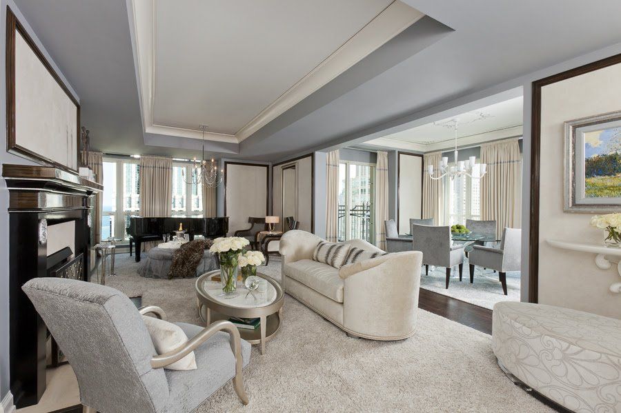 A living room filled with furniture and a piano.