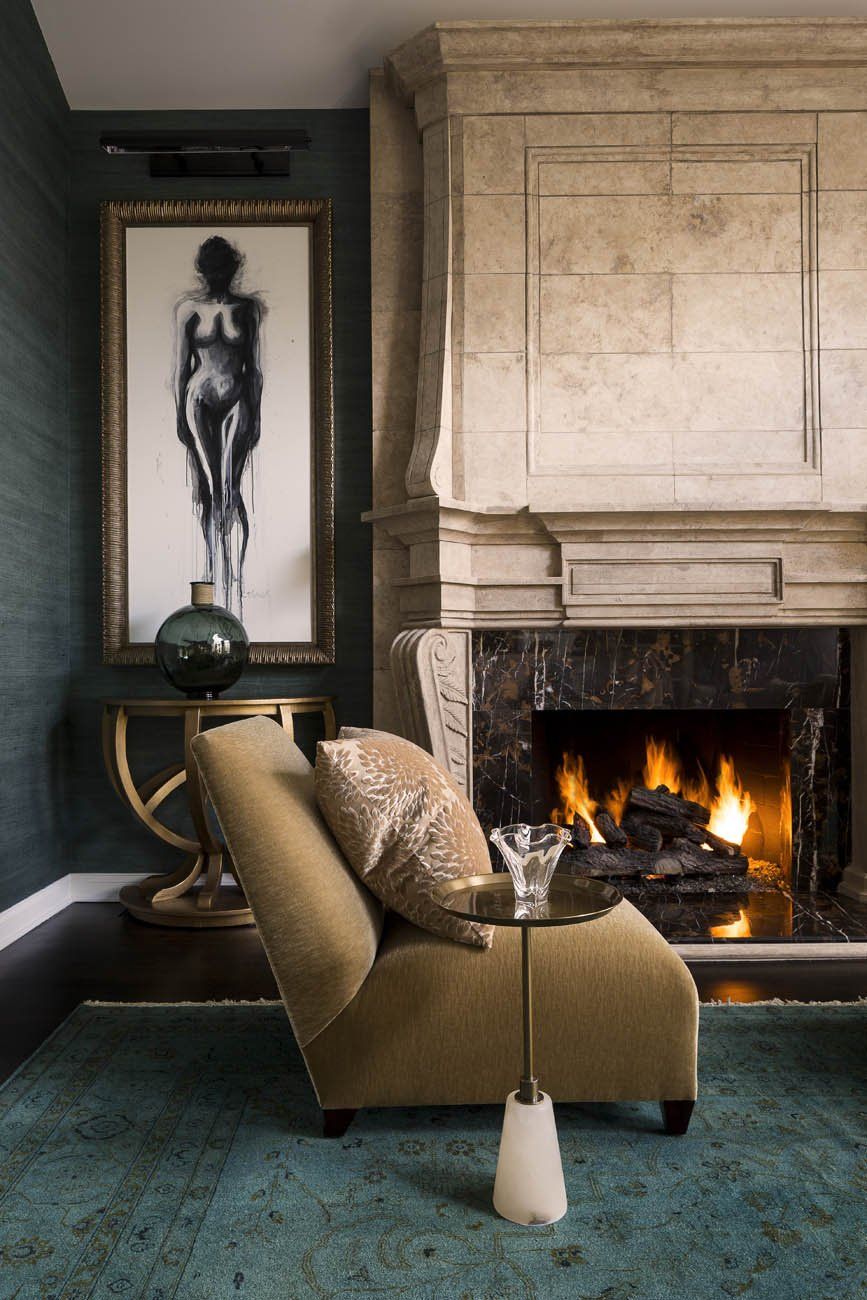 A living room with a fireplace and a chair