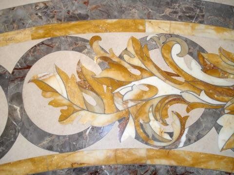 A marble floor with a floral design on it