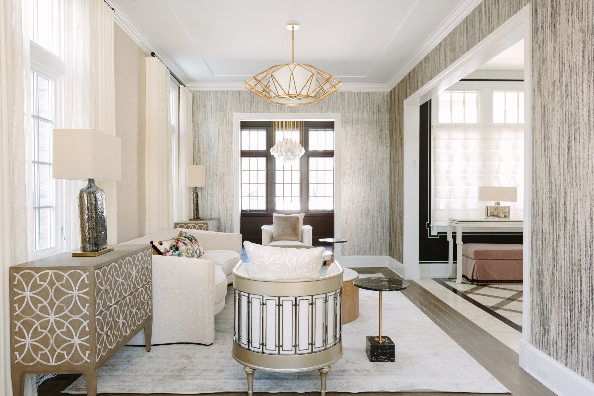 A living room filled with furniture and a chandelier.