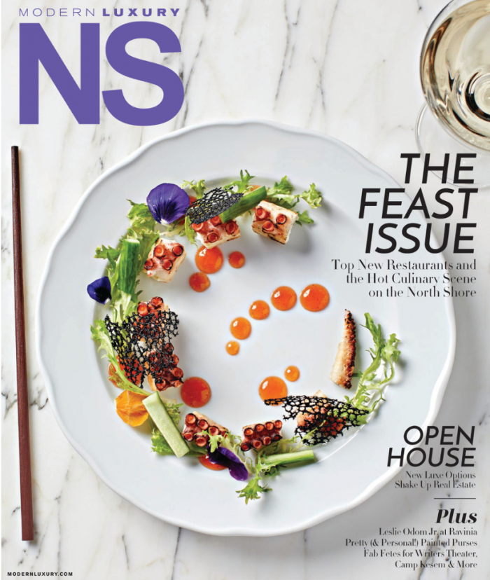 A modern luxury magazine with a plate of food on the cover