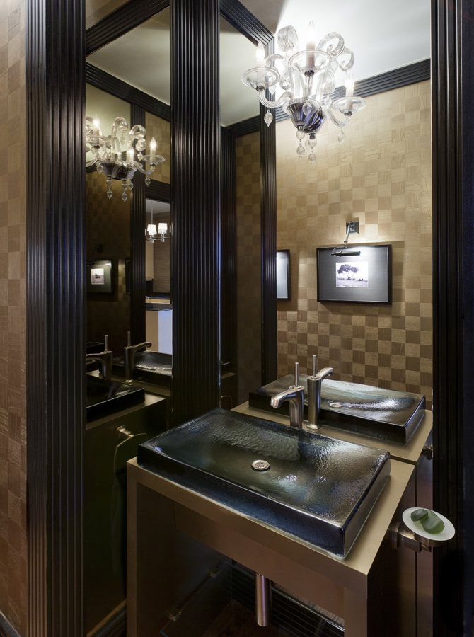 A bathroom with two sinks and a mirror