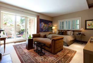 A living room with a couch and a bed