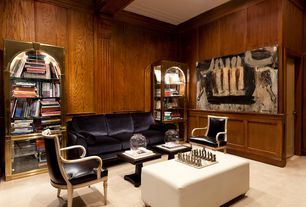 A living room with a couch , chairs , a coffee table and a bookshelf.