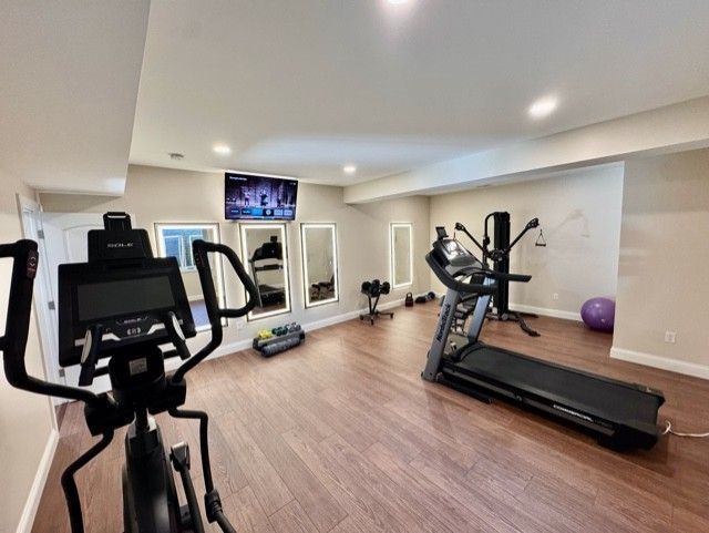 There is a treadmill in the middle of the room.