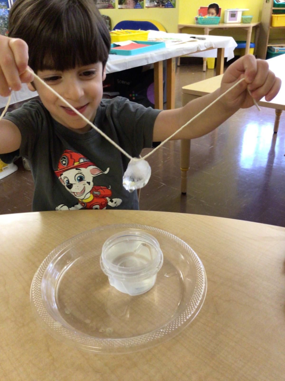A young boy playing with water